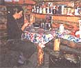 Miki sewing and staying warn inside the completed Twelve-Mile cabin.